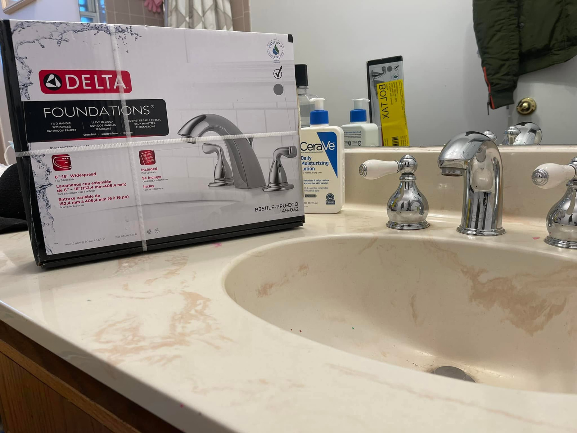 New Delta widespread bathroom faucet ready for installation on a vanity